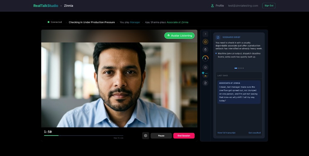 A live Real Talk Studio session: a photorealistic partner on video, and in the side panel a messy, self-protective line — “I mean, last manager made sure the overflow got spread out… so why shift it all my way today?”